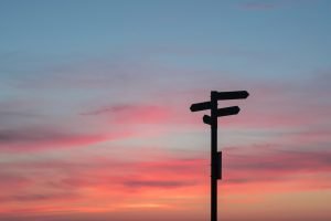 sign post at sunset